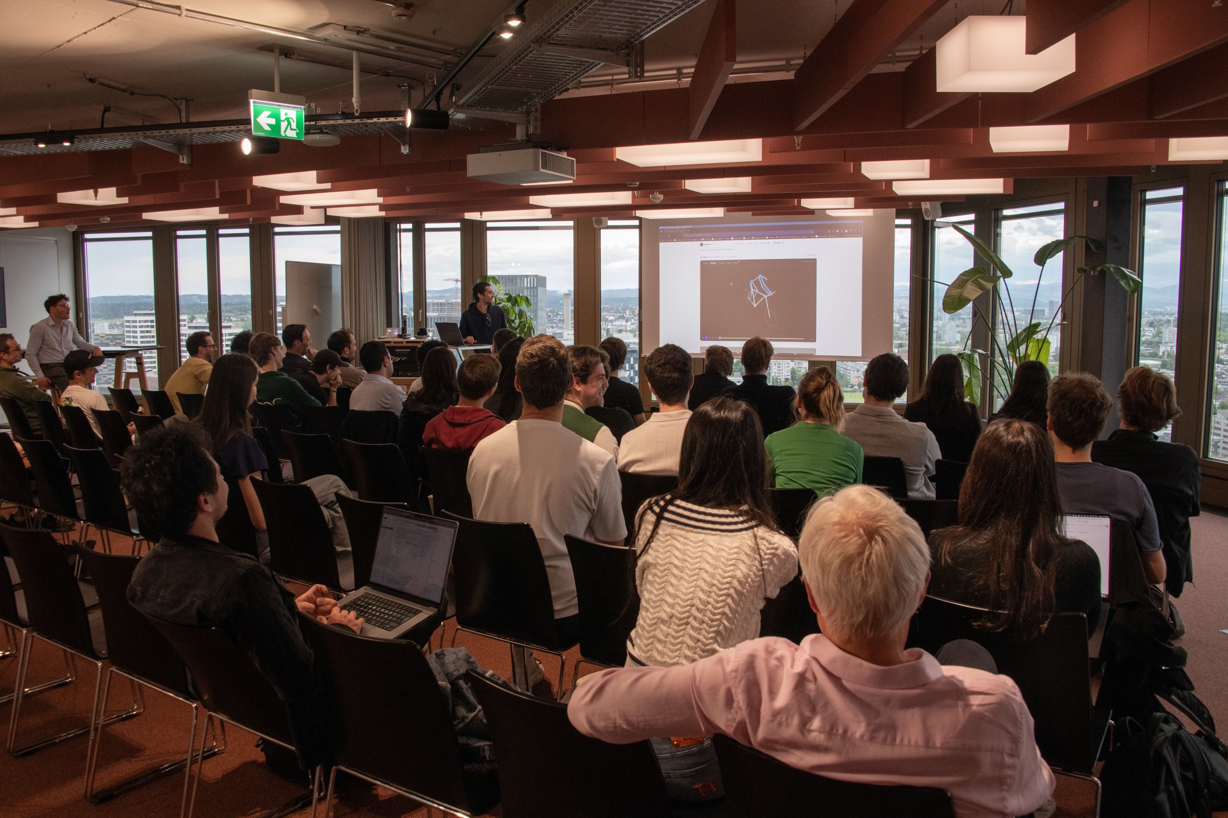 ETH AI Club member Emmanuel Omont demos BaikeFitter at Demo Night, May 2026