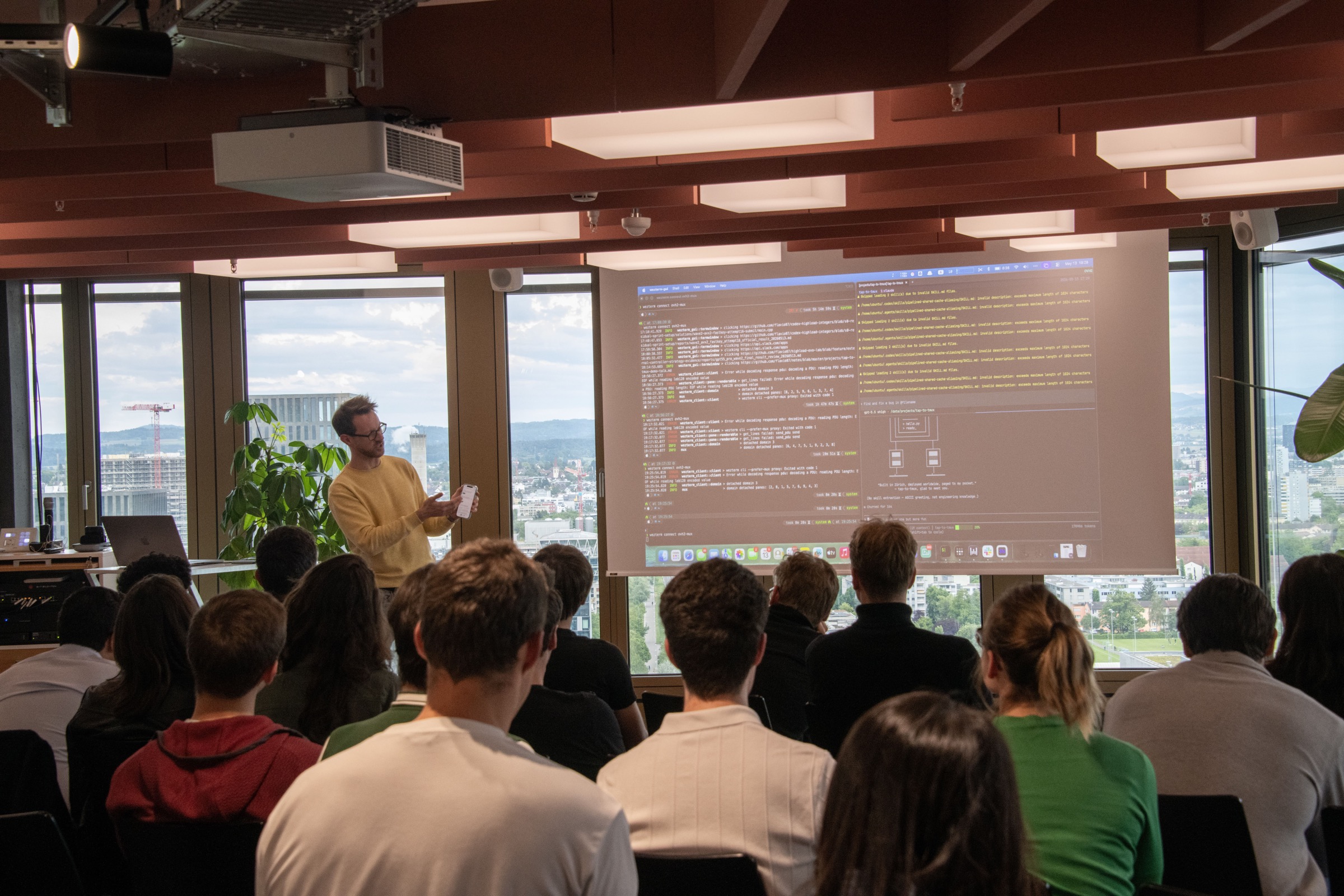 ETH AI Club member Flavio Rump demos tap-to-tmux at Demo Night, May 2026